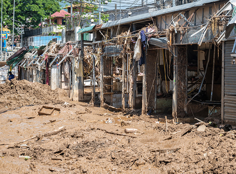 Damaged houses at the border between Myanmar and Thailand