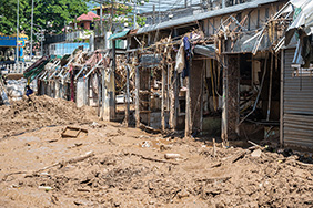 Damaged houses at the border between Myanmar and Thailand