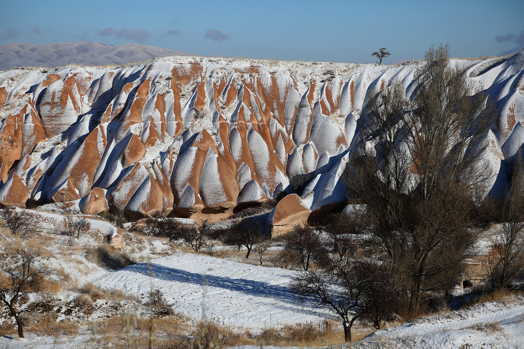 The moon-like volcanic landscape covered in snow at Göreme National Park, Cappadocia, a UNESCO World Heritage Site.