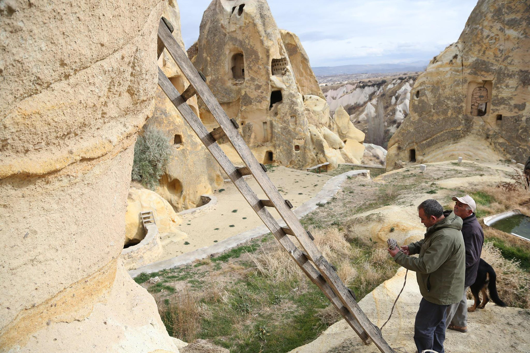 Ahmet and his son Mehmet are collecting pigeon manure from the fairy chimneys.