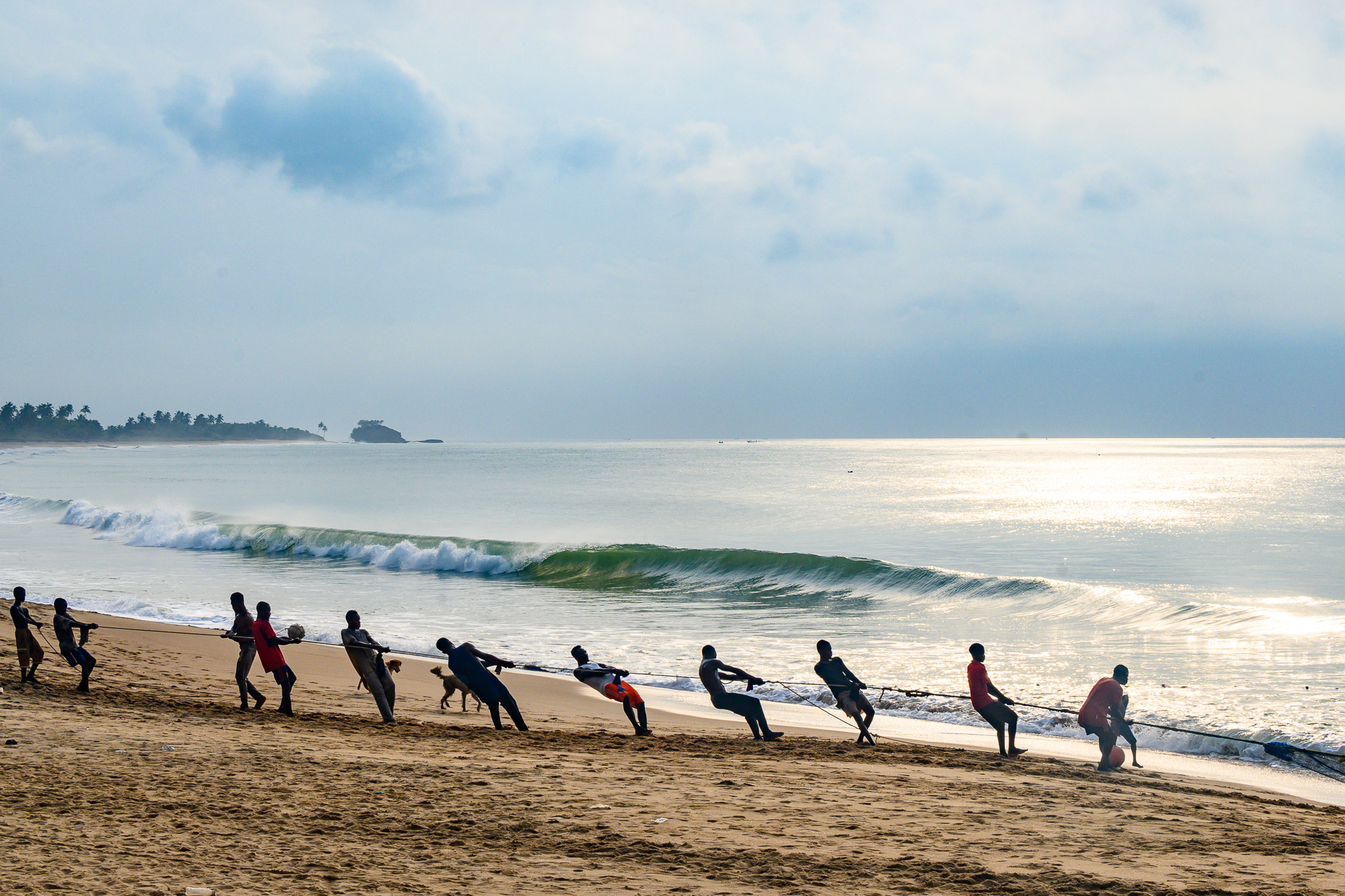 Beach seine fishers pull in a net at Butre, in Ghana’s Western Region